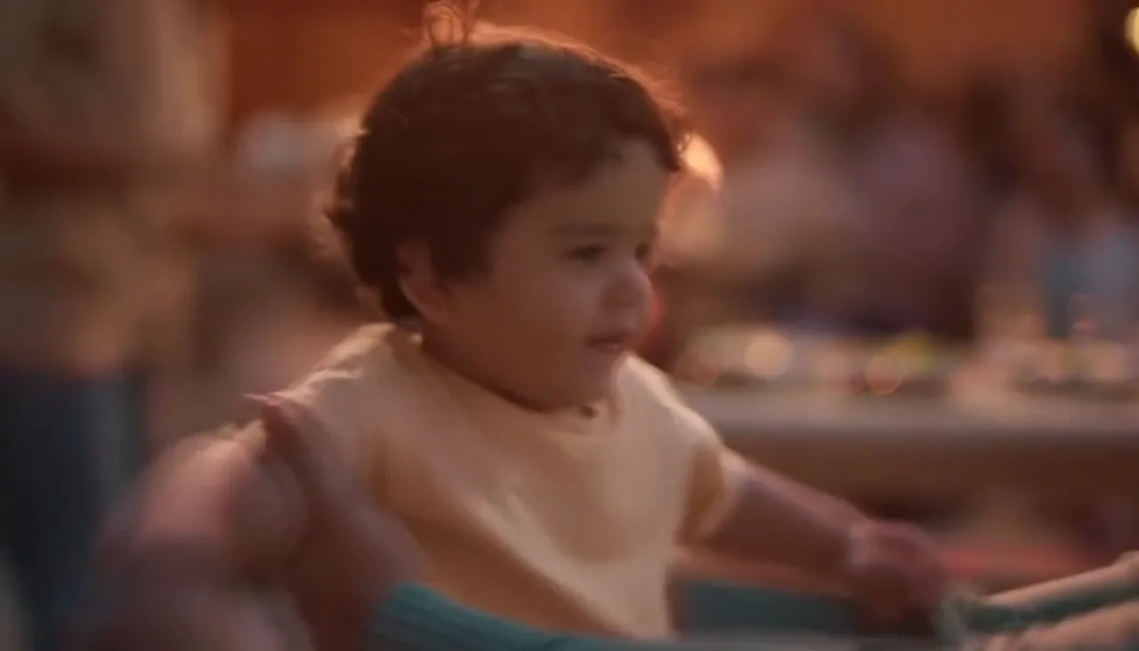 A child's first shoes being fitted in the Center Point First Steps film
